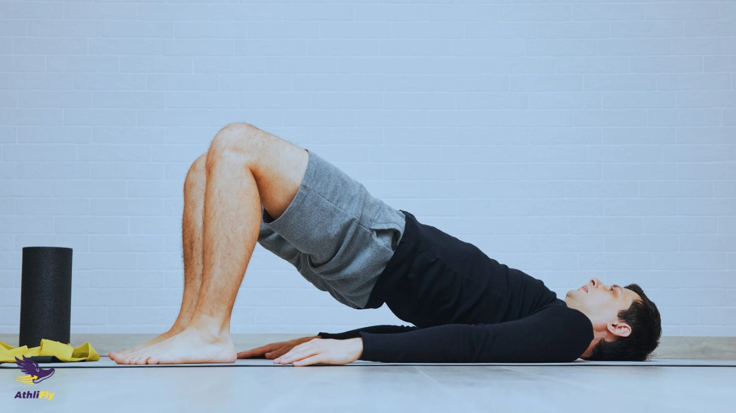 Strength training exercises for beginner 5K runners Beginner seen from a distance performing a glute bridge as part of a 5K strength routine